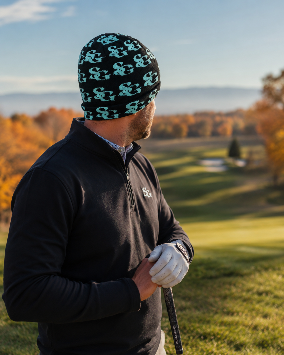 Golfer looking out over the course in the Scramble Gods teal beanie